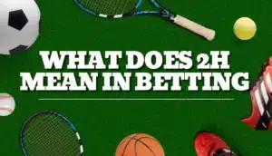 arious sports equipment including a soccer ball, tennis rackets, baseball, basketball, and running shoes on a green field background with the text ‘WHAT DOES 2H MEAN IN BETTING’ displayed prominently